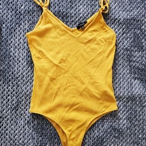 Yellow bodysuit